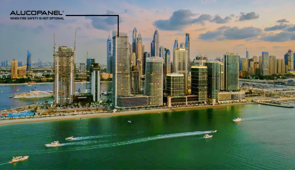 Wide-angle view of Grand Bleu Tower by Elie Saab at Emaar Beachfront, showcasing the full-height cladded façade with Alucopanel® A2 ACM.
