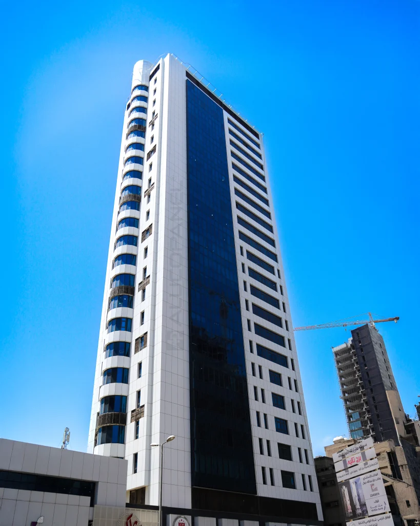 Daylight view of AL-SHOROUK Towers showcasing fire-retardant Alucopanel cladding