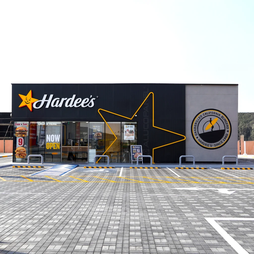 Retail branding solution for Hardee’s using ALUCOSIGN Royal Black aluminium composite panels