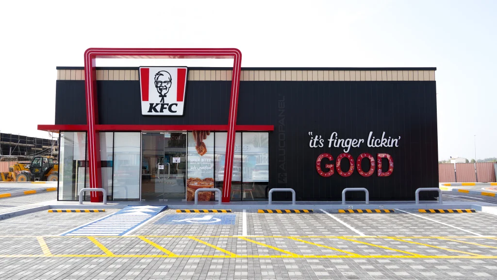 Exterior KFC signage using ALUCOSIGN aluminium composite panels on a low-rise building