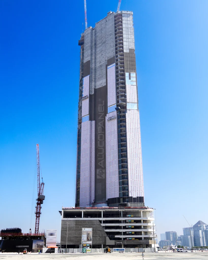 Nautica One Dubai façade showcasing metallic bronze and Dark Nebula V3 panels.