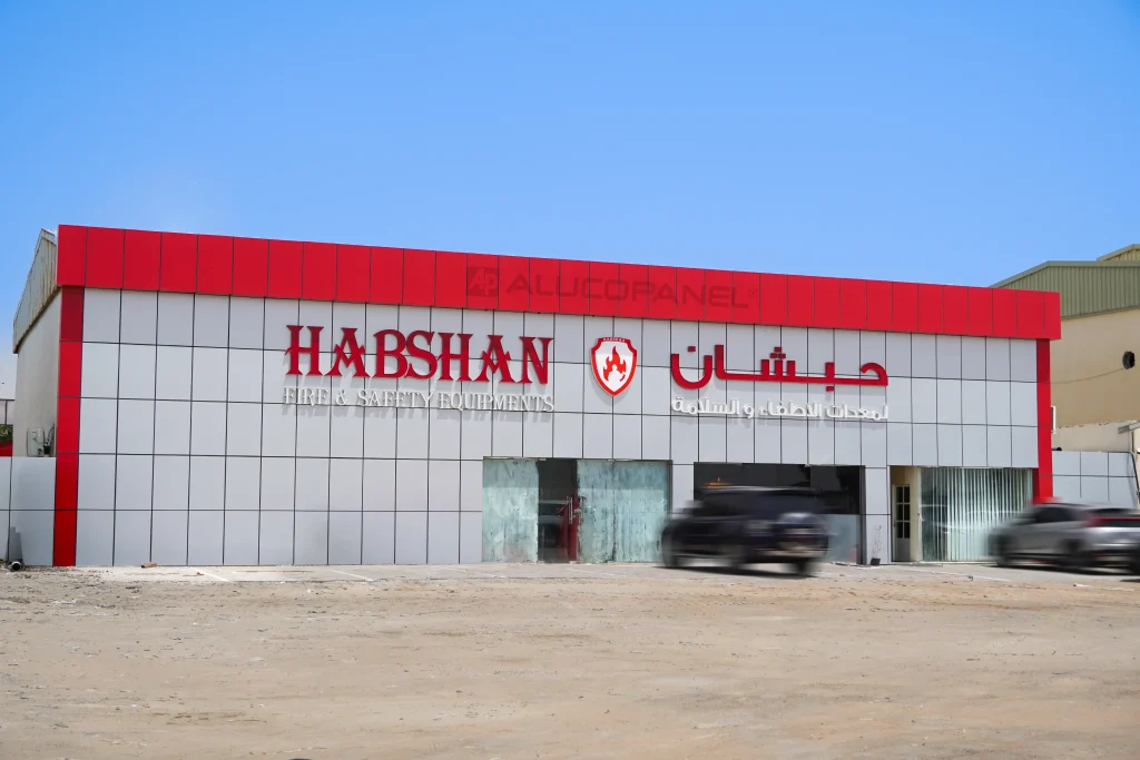 Full front view of Habshan Fire & Safety Equipments showroom clad in white and red Alucopanel aluminium composite panels