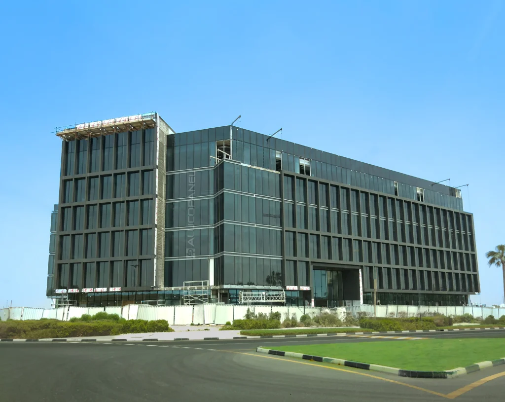 Aviation Office building in Dubai clad with charcoal grey Alucopanel aluminium composite panels framing a glass curtain wall facade