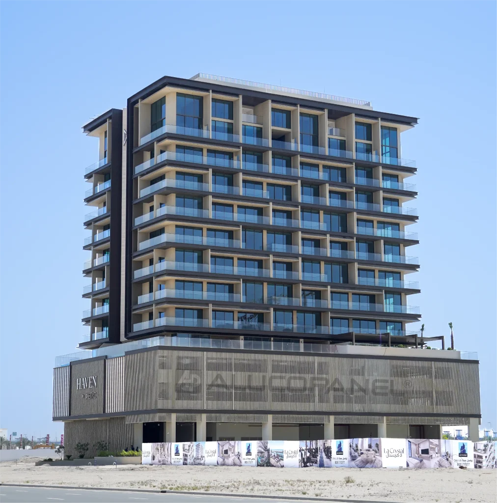 Full exterior view of Haven by Metac residential building in Dubai with Alucopanel A2 aluminum composite panel facade in Medium Bronze and Champagne Metallic